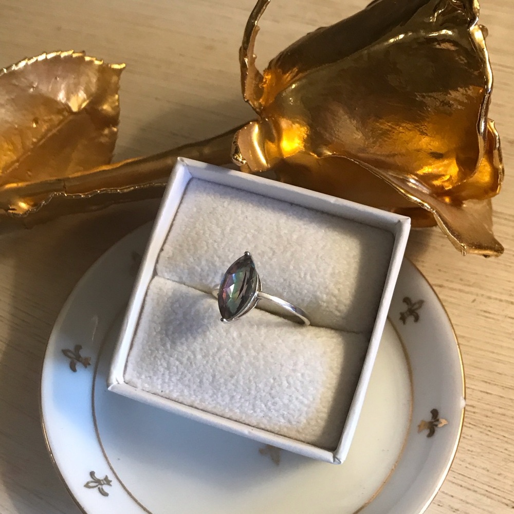 Gorgeous marquis cut Mystic Fire Topaz.  Size 9.5 set in .925 sterling silver.